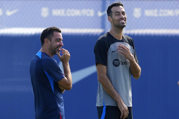 Xavi og Busquets voru samherjar í sjö ár áður en Xavi skipti yfir til Al-Sadd í Katar.